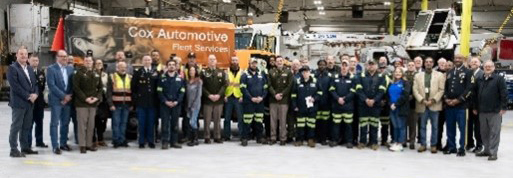 Following the ceremony, Veterans that work for Fleet Services by Cox Automotive pose for a picture to recognize their service with Recruiters and Soldiers from the Indianapolis Recruiting Battalion.