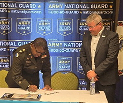 LTC Kim Wynn and Mr. David Scorey sign the ceremonial agreement.