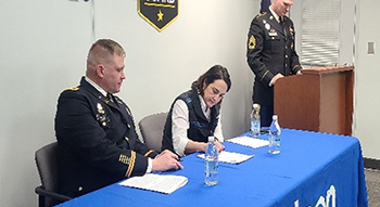 Ms. Tungul and COL Kelsey sign the PaYS Ceremonial MOA, marking the partnership between the AKARNG, Matson and PaYS.