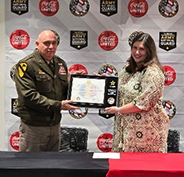 (l-r) BG Izzo presents plaque to Ms. Jones at the Coca-Cola Bottling Company United signing ceremony