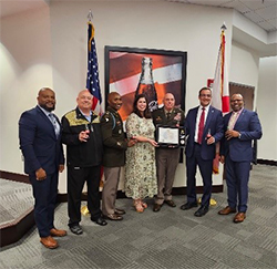 Victor, James Trammell, MAJ Morrecus Foster, Ms. Gianetta Jones, BG Mike Izzo, Mr. Mike Suco, and Samuel