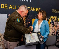 COL Norton presents the plaque to Ms. Esparza.