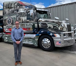 Bolio poses in front of a Gully Gold Star truck