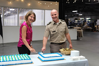 Metal Craft cake cutting with LTC Justin Ducote and Trish Mowry