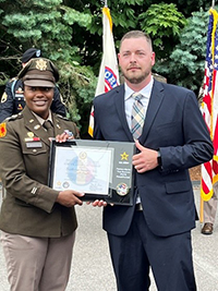 (l-r) LTC Diontanese Monroe, Commander, New England Recruiting Battalion presents the PaYS plaque to Michael Conroy, Director of Recruiting and Field Operations, Northeast Security, Inc.