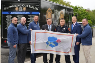 (center) Suffolk County Executive, Ed Romaine, (second from right) President, Suffolk County Police Benevolent Association, Lou Civello and officers of the Suffolk County PD