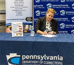 Dr. Harry signs the Ceremonial signing document