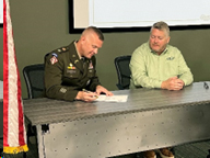 LTC Nick Swoboda and Mr. Brent Ellis sign the PaYS agreement 