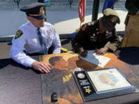 (l-r) Chief Lully and LTC Diontanese Monroe signed the ceremonial agreement