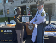 (l-r) LTC Diontanese Monroe presents LTC Lully with the PaYS plaque.