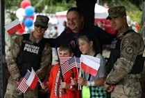 Military Police Guardsmen with children at the celebration. 