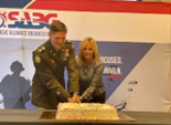 LTC Miles and Mrs. Mungo cut the cake following the ceremony 