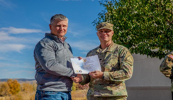 Mr. Mark Donner (CEO, Trihydro) is awarded a Certificate of Appreciation by LTC Paul Leoni.