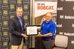  Mr. Roy Greco, Chief Digital Officer, Bobcat is presented a plaque by CSM Jason Magnuson, Senior Enlisted Advisor, NDARNG