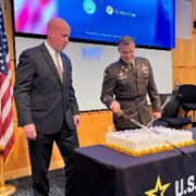 Adam Holton and LTC Oliver Karp cut the ceremonial cake