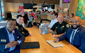 CASA Landy Dunham, Seminole County Sheriffs Office Lt Robert Smith Jr., LT Brad McDaniels and Victor Fleming, PaYS Marketer