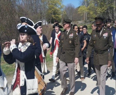LTG Robert Harter and CSM Gregory Betty marching with period reenactors