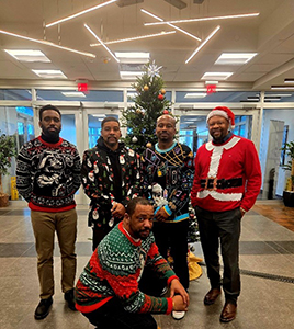 Some of the team in their ugly Christmas sweaters
