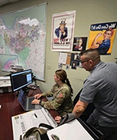 Roy Kidwell with SFC Corey Black as she registers for PaYS