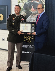 LTC Eliot Proctor, Commander, Milwaukee Recruiting Battalion presents plaque to Troy Streckenbach, County Executive, Brown County