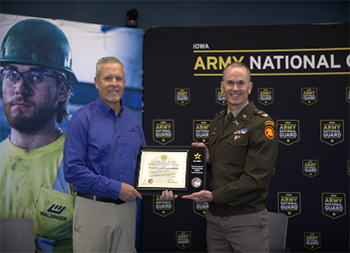 Mr. Hileman and COL Stanford take photo with the PaYS partnership plaque to share partnership