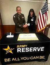 LTC Luna and Ms. Price cutting the cake   