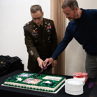 LTC Gregory Humble and Mr. Matthew Gutchess cut the ceremonial cake