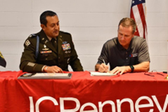 Mr. Mark Conte and LTC Ceja sign the Memorandum of Agreement establishing partnership