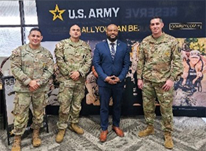 Victor Fleming stands with MSG Schmidt and recruiters in front of the West Orlando Recruiting Station