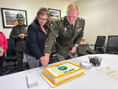 LTC Sadoski and Ms. Briceno cut the cake 