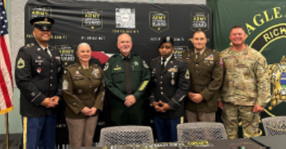 (Left-right) Sgt. First Class Watson, Command Sgt. Major Furry, Sheriff Staly, Sgt. First Class Gadson, Maj. Wiseman, and Master Sgt. Byerly after the U.S. Army PaYS Program Signing Ceremony