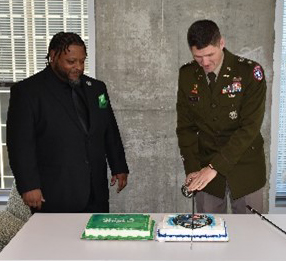 LTC Miles and Mr Parker cut the cakes following the ceremony.