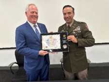 Mr. Tim McBride and LTC Clinton Gutierrez with the PaYS plaque 