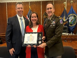 Mr. Butler, Mayor Pierce, and Col. Meyer celebrate the new partnership